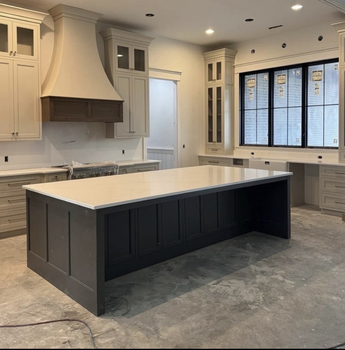 Cream kitchen with charcoal island