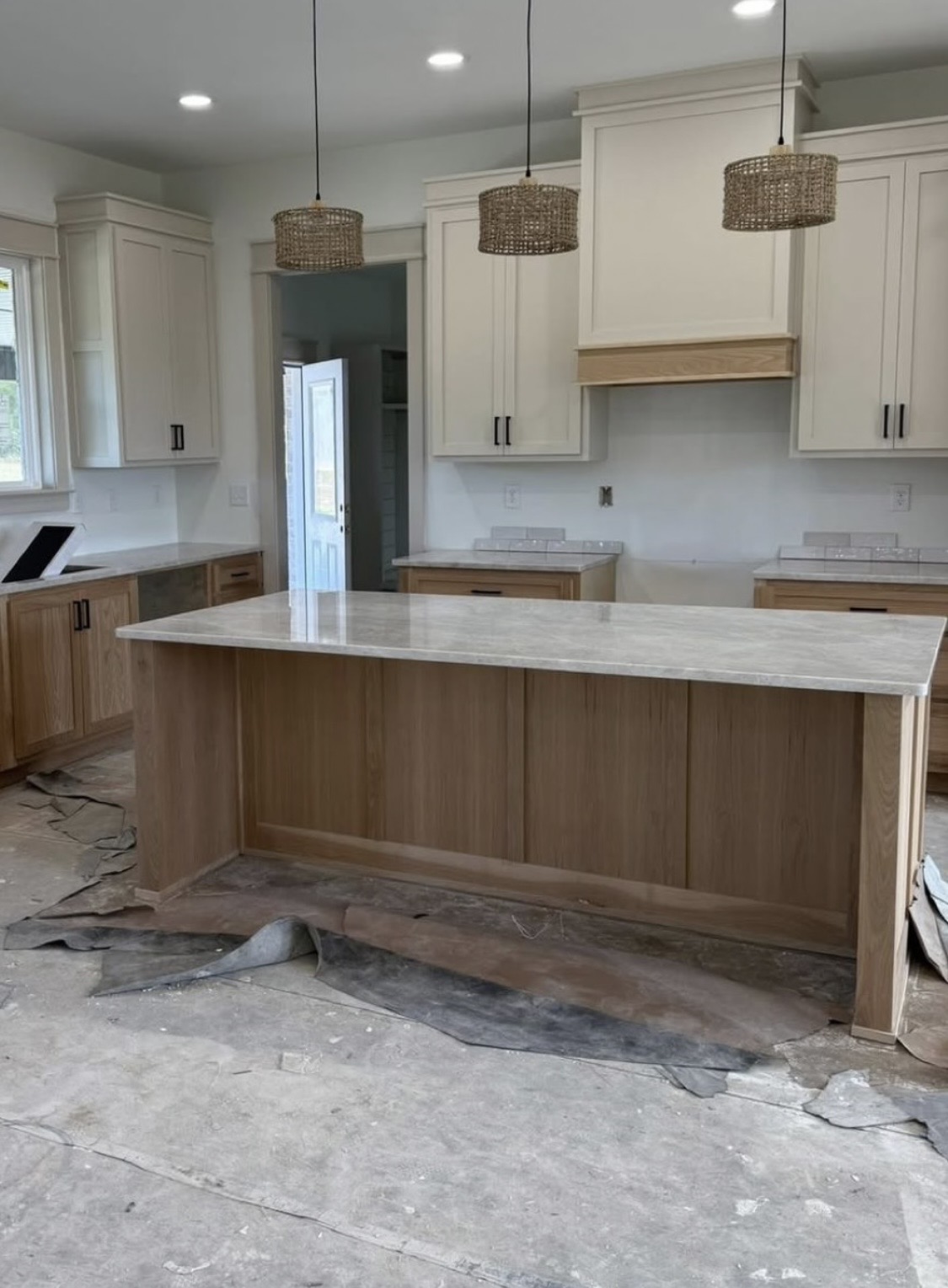White oak island & cream cabinets