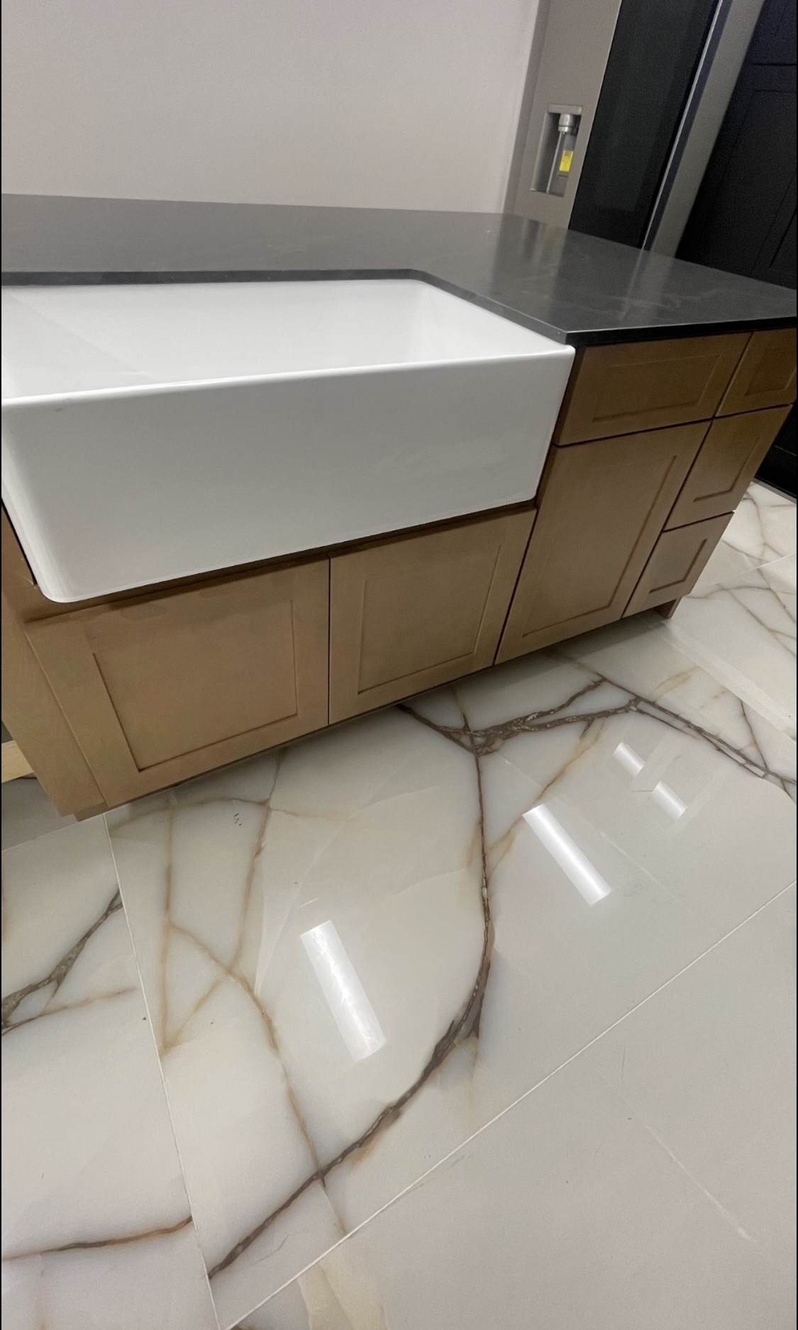 Farmhouse sink in maple vanity